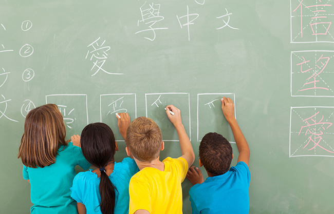 http://www.dreamstime.com/royalty-free-stock-photos-students-learning-chinese-rear-view-elementary-school-writing-chalkboard-image32556488